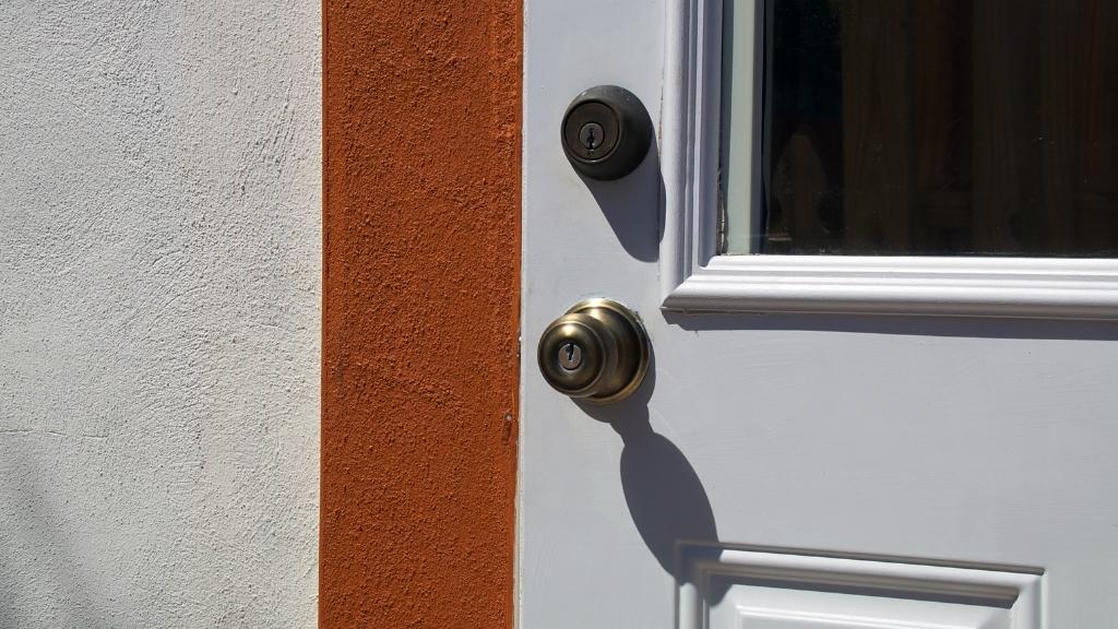A deadbolt is a type of lock with a latch that is square in shape and is opened with a physical key. 

 