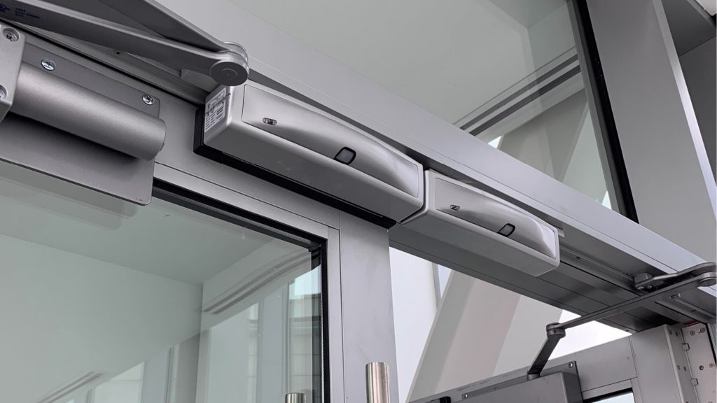 Commercial doors with magnetic locks