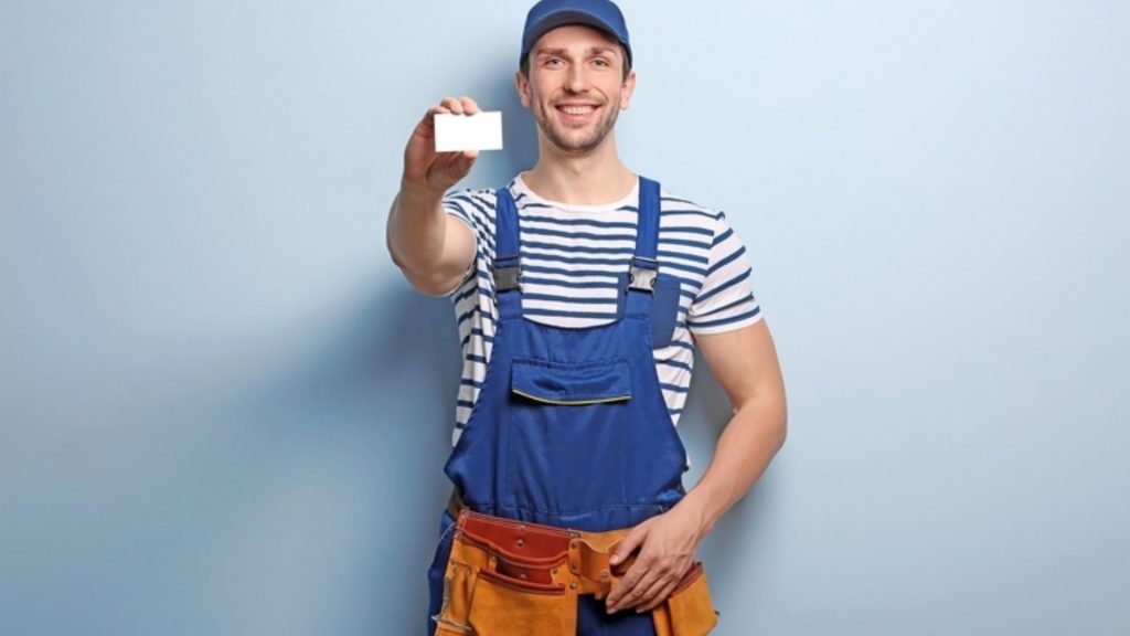 A locksmith showing his locksmith service business card